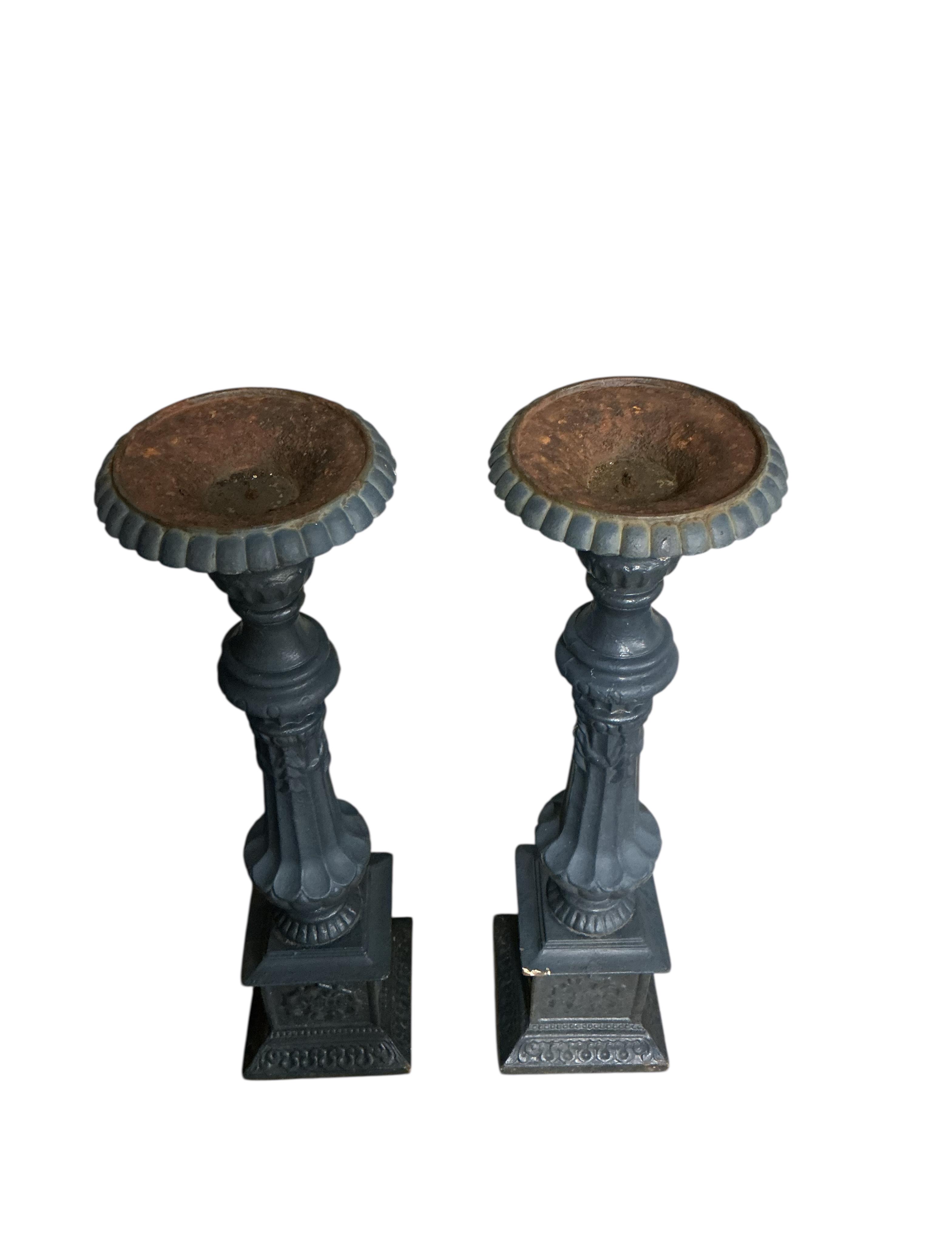 A pair of Victorian style painted cast iron stands, height 102cm